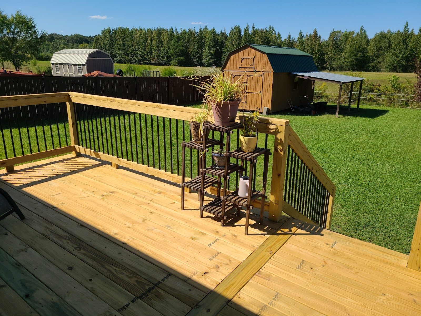 Wood deck with black railing